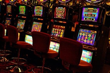 Sic Bo live dealer studio with three dice and betting board displayed on screen